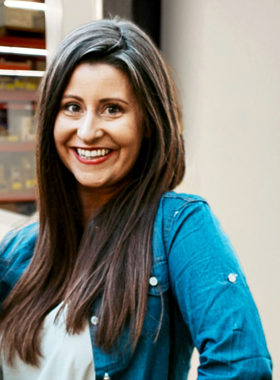 smiling woman in blue button down